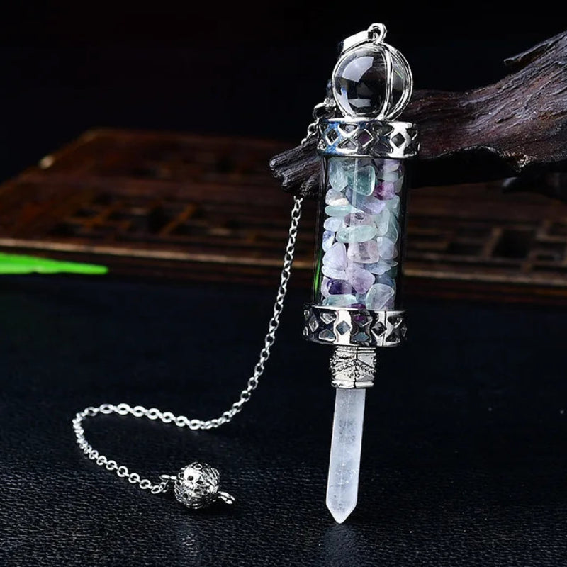 Glass chamber, crystal chips and pointed pendulum with chain: Crystal Chip Glass Bottle Divination Pendulum, featuring a crystal-chip glass bottle with an elongated point and chain.