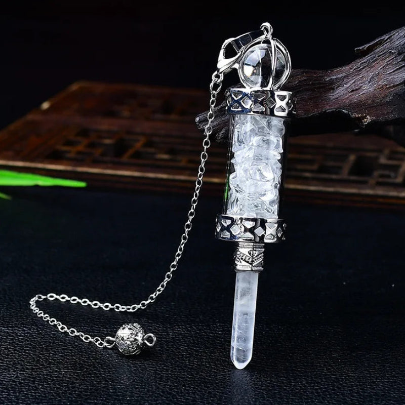 Glass chamber, crystal chips and pointed pendulum with chain: Crystal Chip Glass Bottle Divination Pendulum, featuring a crystal-chip glass bottle with an elongated point and chain.