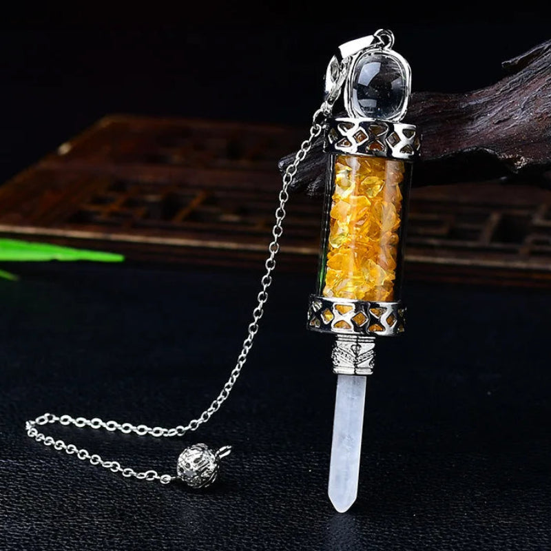 Glass chamber, crystal chips and pointed pendulum with chain: Crystal Chip Glass Bottle Divination Pendulum, featuring a crystal-chip glass bottle with an elongated point and chain.