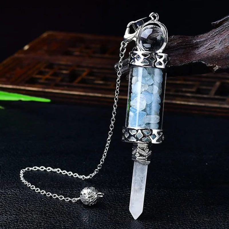 Glass chamber, crystal chips and pointed pendulum with chain: Crystal Chip Glass Bottle Divination Pendulum, featuring a crystal-chip glass bottle with an elongated point and chain.