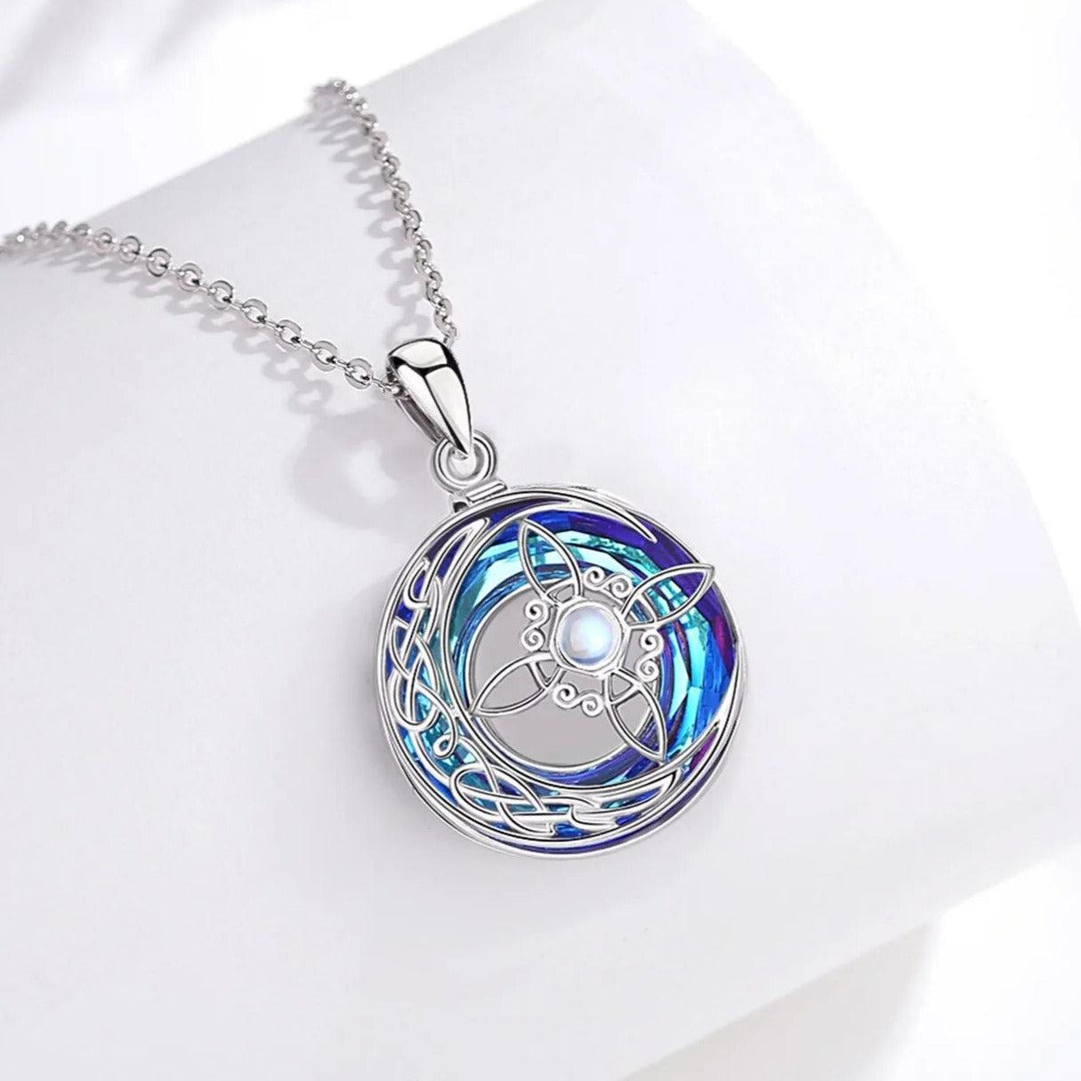 Sterling silver Crystal Moonstone Witch Knot Necklace, featuring a vibrant blue and purple crescent moon design.