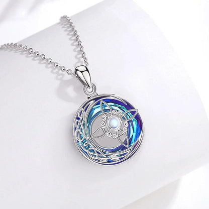 Sterling silver Crystal Moonstone Witch Knot Necklace, featuring a vibrant blue and purple crescent moon design.