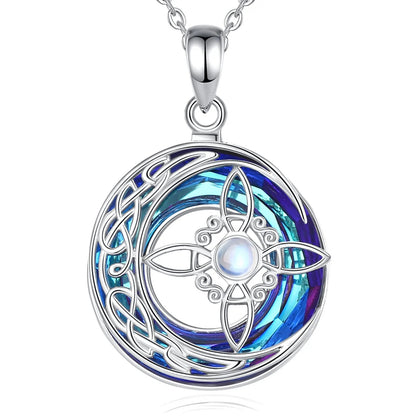 Sterling silver Witch Knot amulet with a crystal moonstone and vibrant blue-purple crescent design.