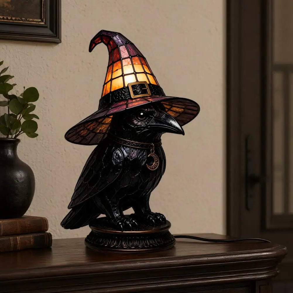 Dark academia raven witch hat night light on entryway table with books and plant