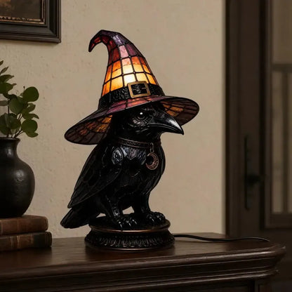 Dark academia raven witch hat night light on entryway table with books and plant