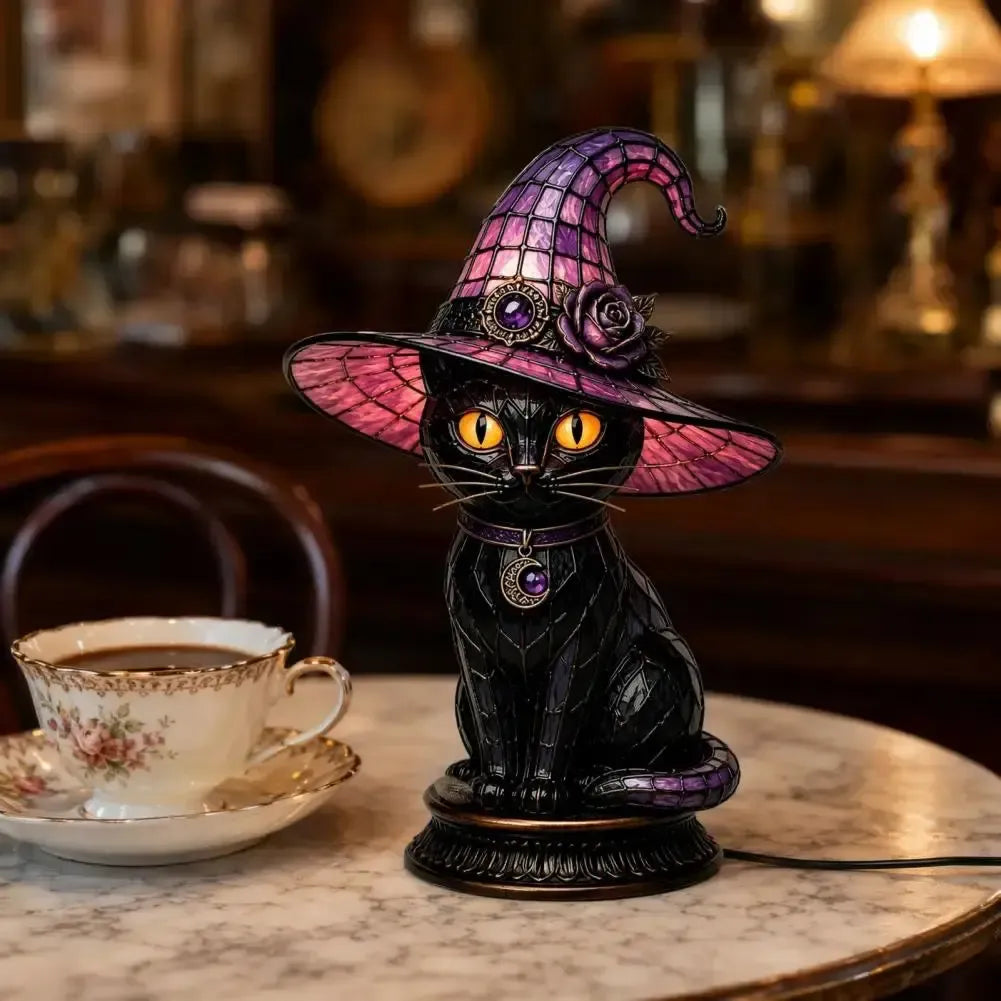 Dark academia black cat witch hat night light on marble table with vintage teacup