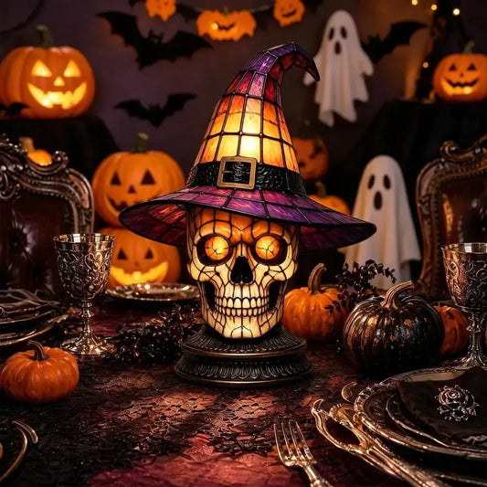 Dark academia skull witch hat night light on Halloween dinner table with pumpkins and ghosts