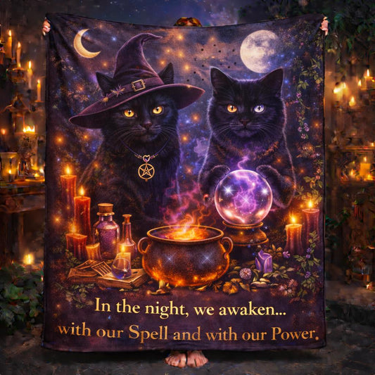 Dark witchy black cats Halloween blanket with a witch hat, pentacle, crystal ball, cauldron, and candles.