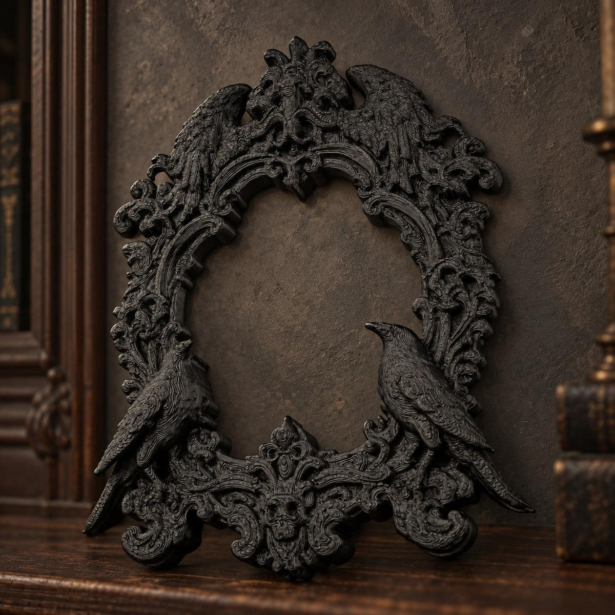 Front view of black double raven frame resting on dark wood against a gothic wall