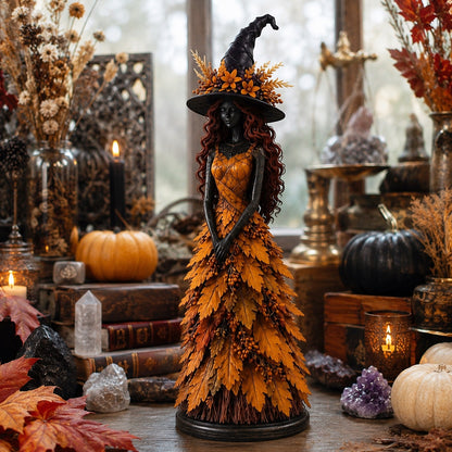 Golden Harvest yellow witch figurine surrounded by crystals books and pumpkins