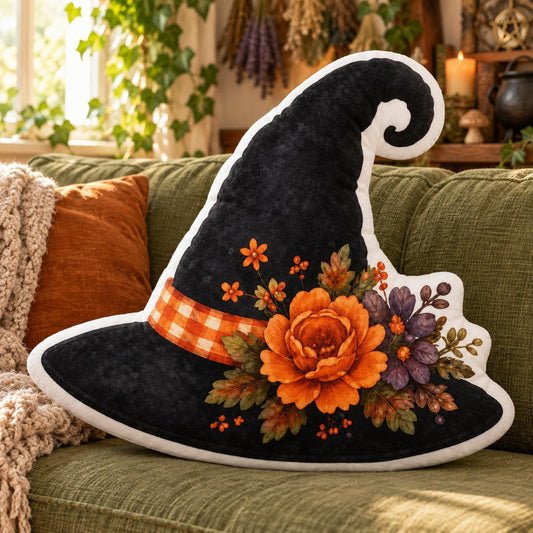 Floral Witch Hat Plush Pillow in a sunlit witchy room