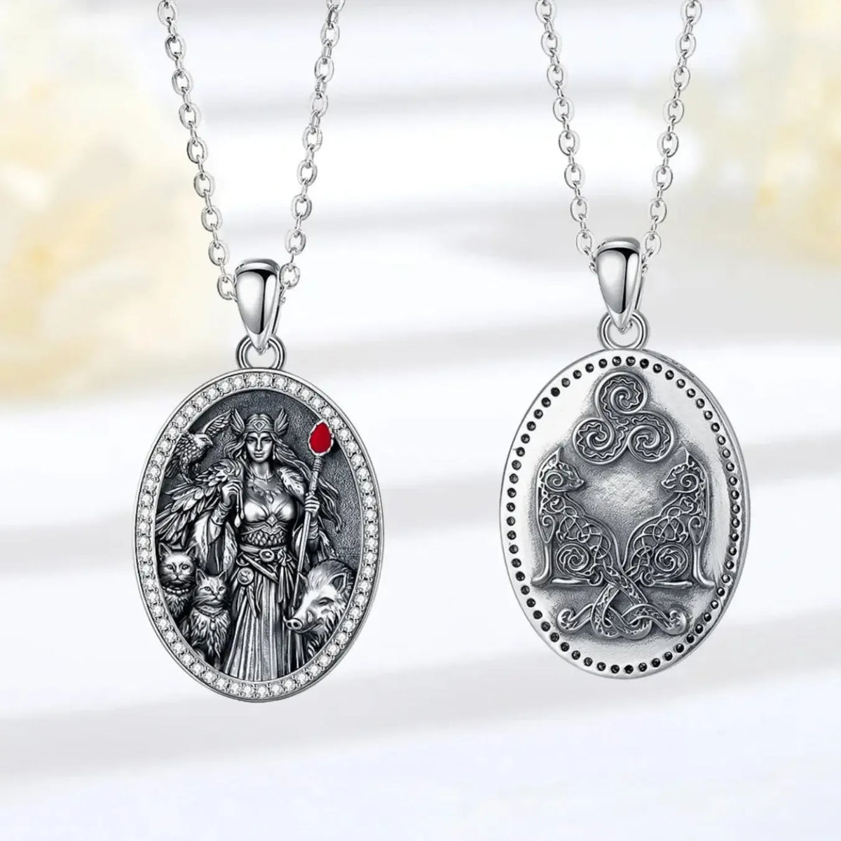 Cat, boar and falcon detailing on the Norse goddess pendant