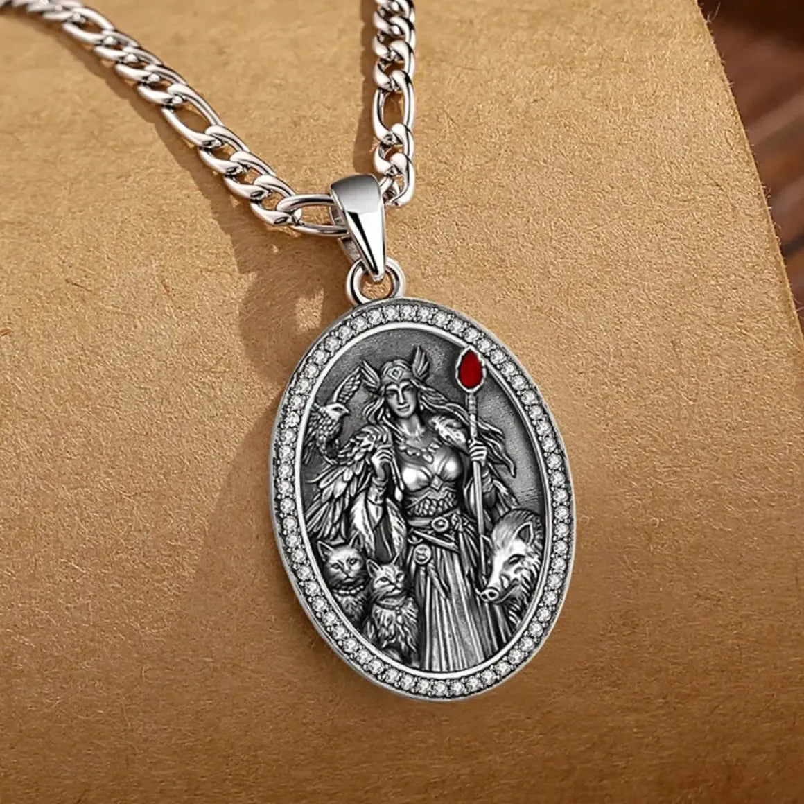 Sterling silver Freya pendant worn over a dark neckline