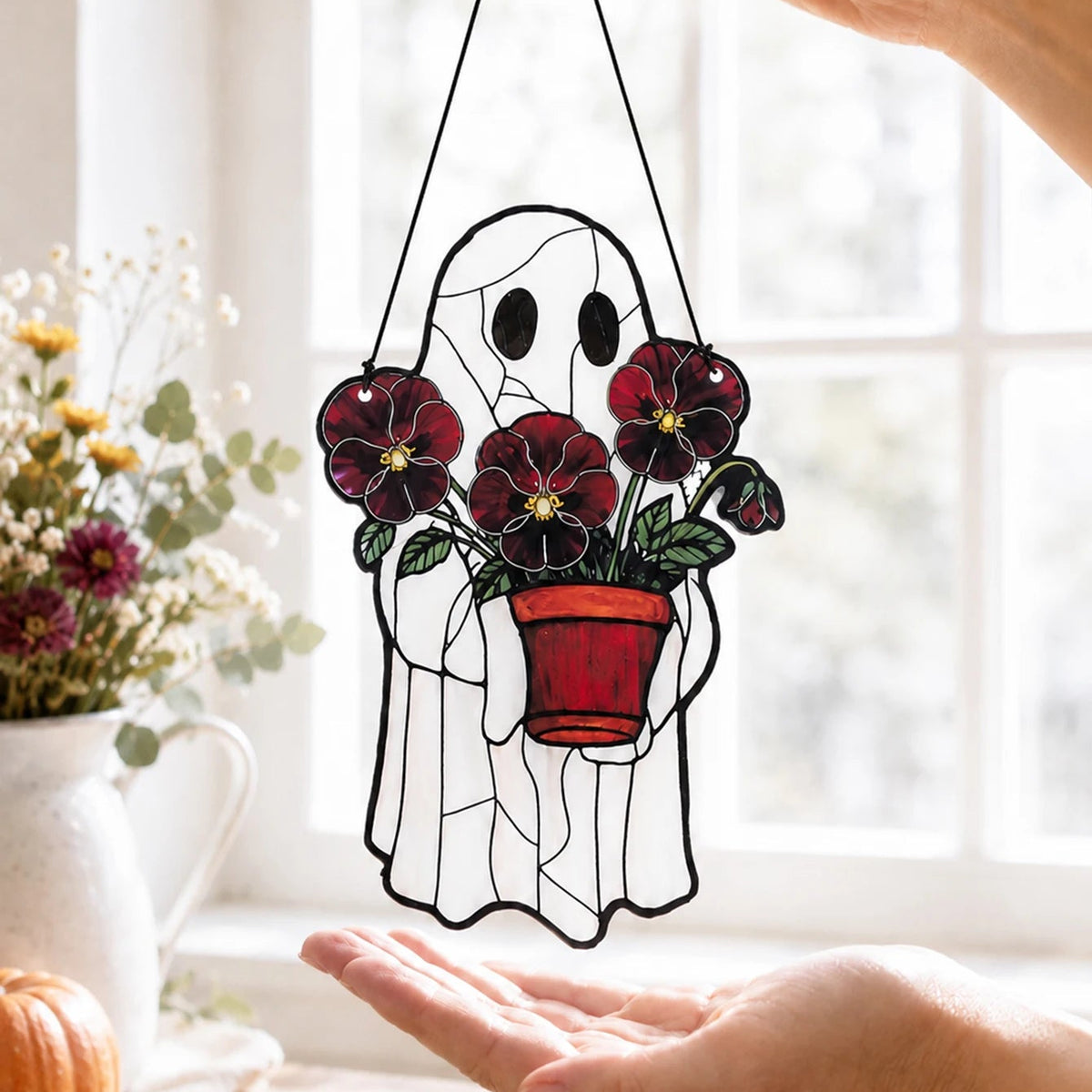 Halloween ghost window hanging shown backlit