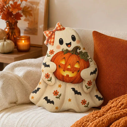 Styled room view: decorative plush pillow featuring ghost and jack-o-lantern imagery