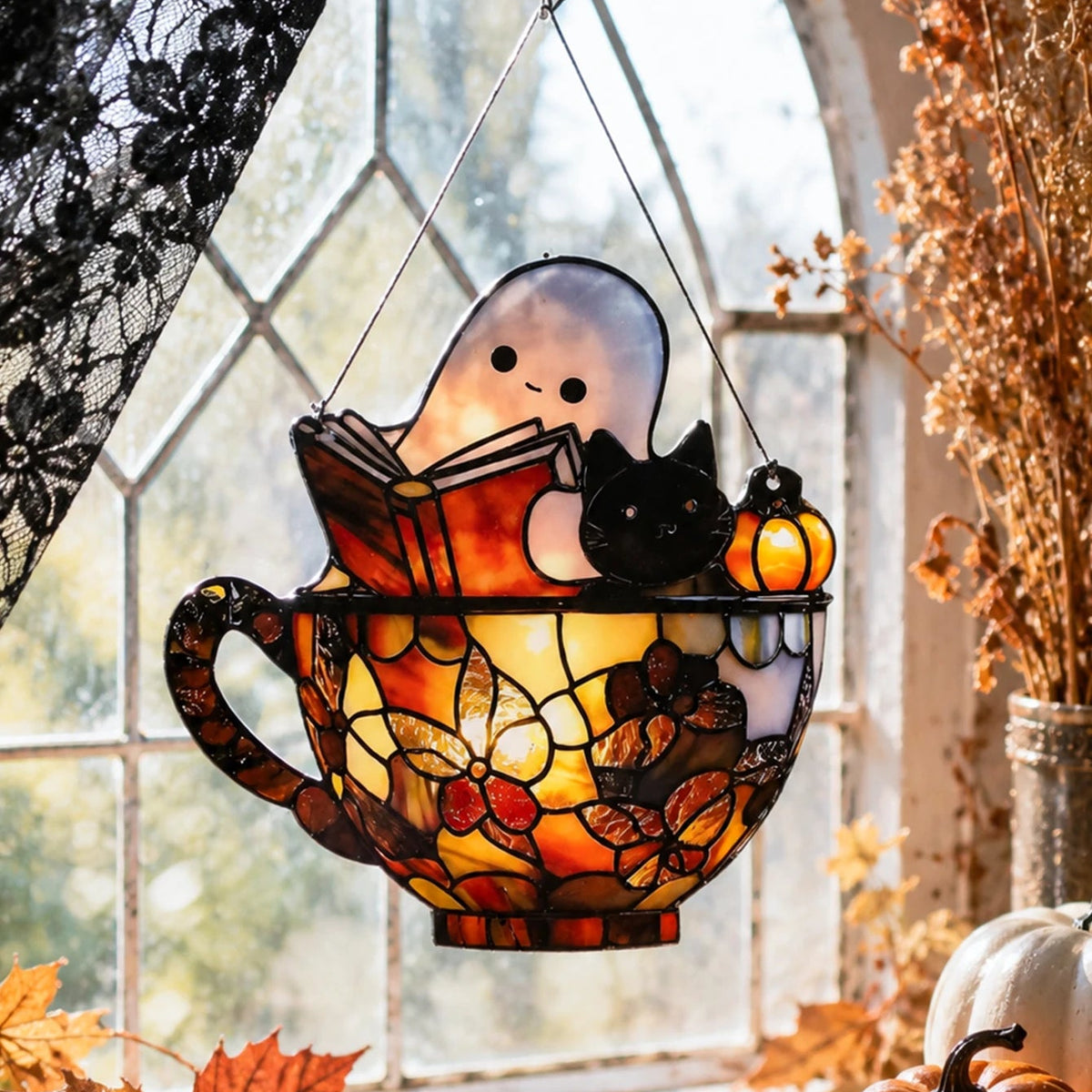 Ghost reading a book suncatcher with a cat and pumpkin