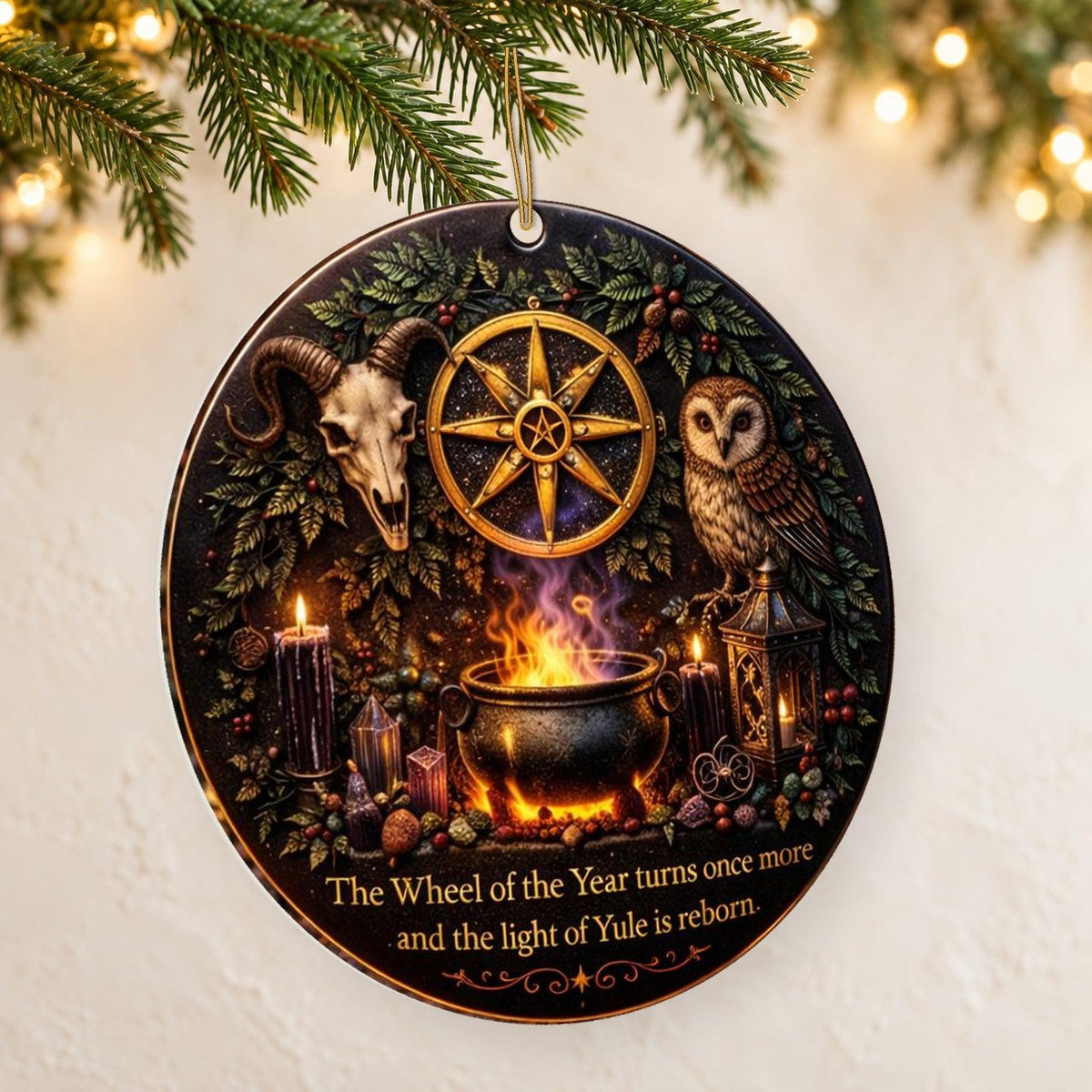 Gold Sun Wheel & Ram Skull Wicca and Pagan Yule Ceramic Ornament – Witchy Christmas Decoration — thin double-sided ceramic ornament, left angled hanging view.