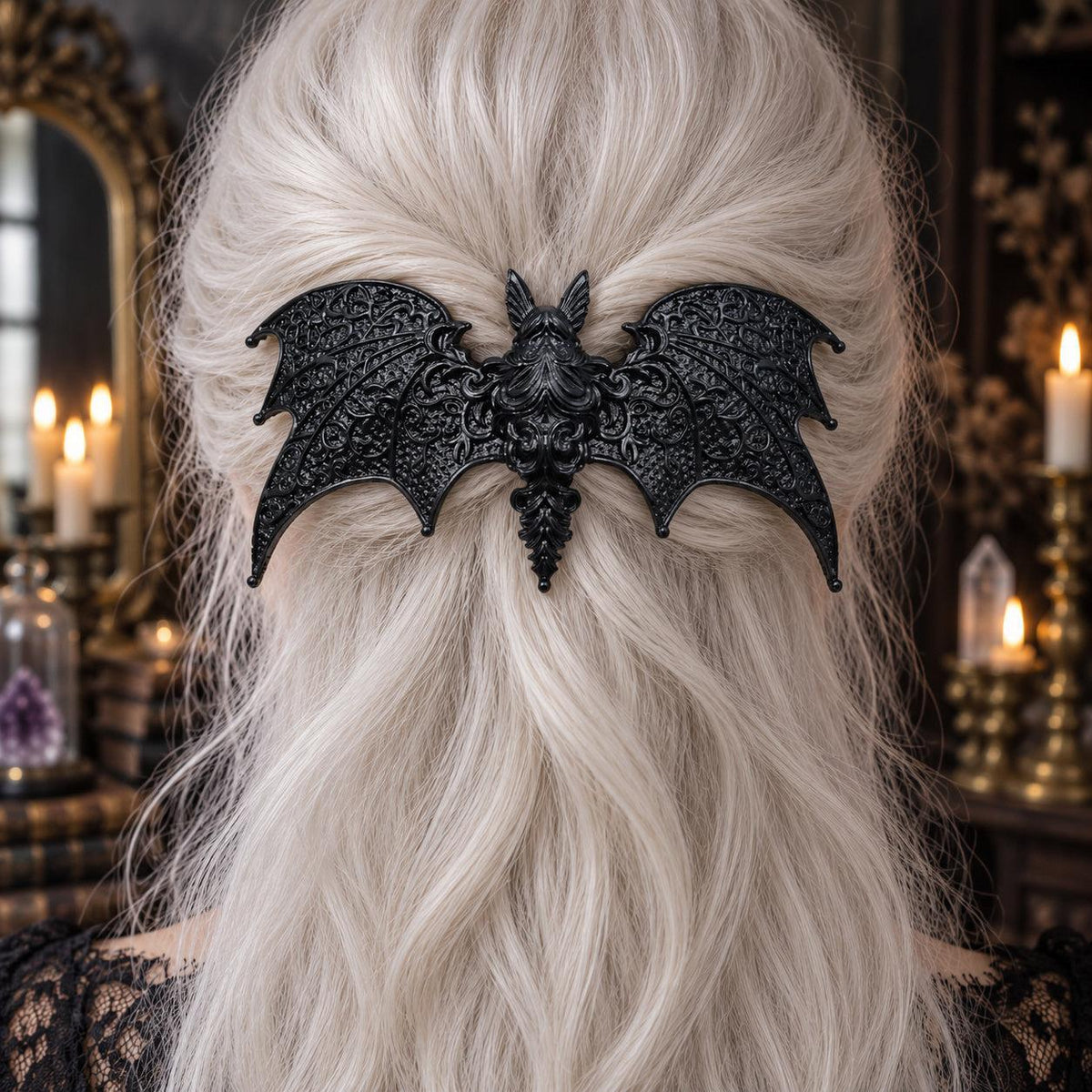 Black Baroque Bat Hairpin in White Hair worn by a witch in a candlelit mystical room