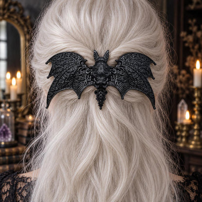 Black Baroque Bat Hairpin in White Hair worn by a witch in a candlelit mystical room