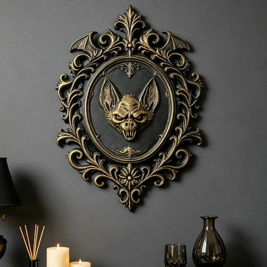 Styled interior wall display: Gothic Bat Relief Wall Plaque, featuring a central bat relief, an oval medallion and elaborate Victorian scrollwork.