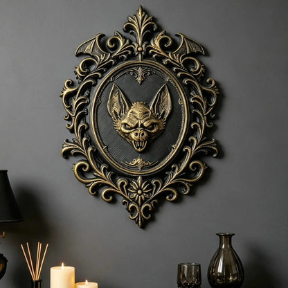 Styled interior wall display: Gothic Bat Relief Wall Plaque, featuring a central bat relief, an oval medallion and elaborate Victorian scrollwork.