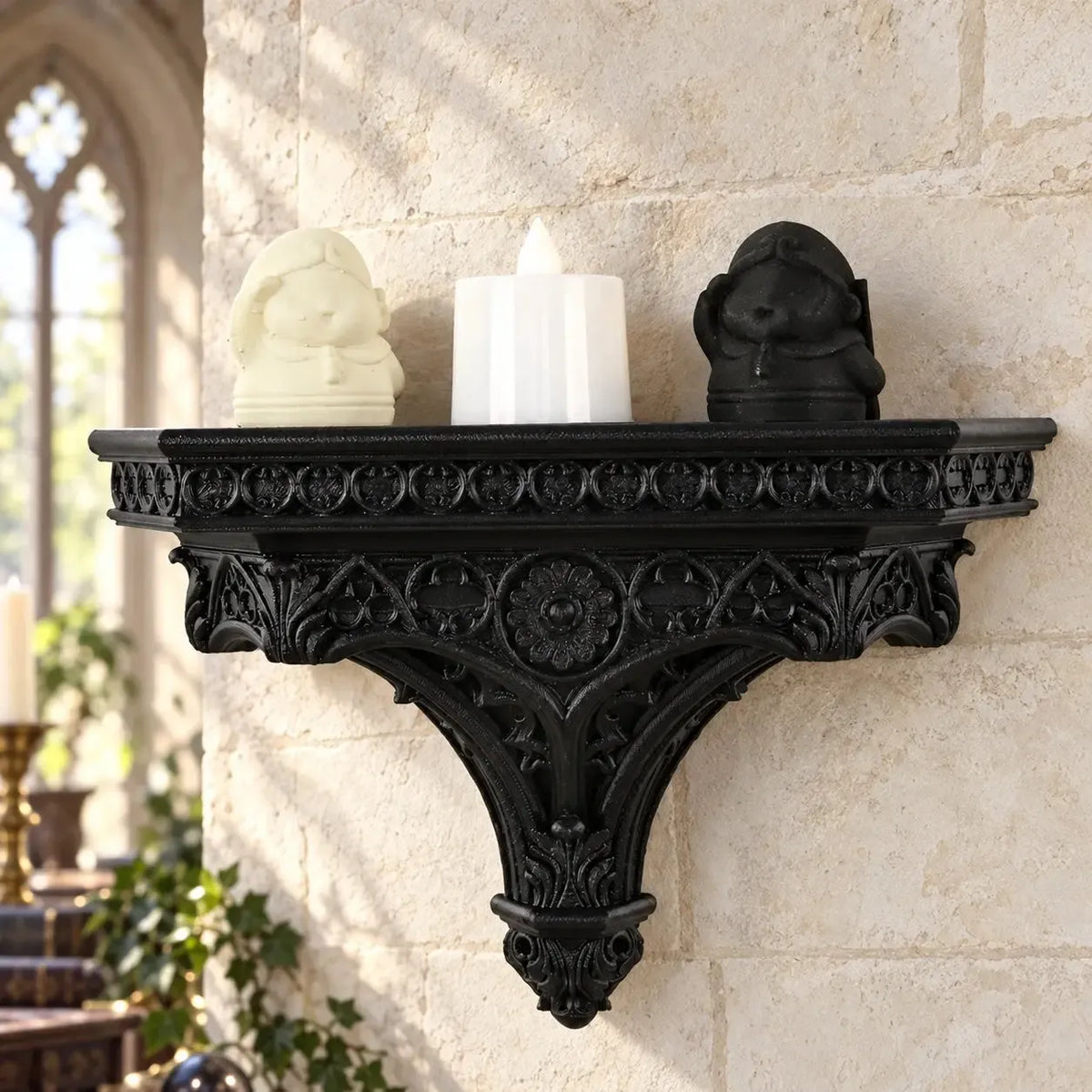 Cathedral wall shelf with figurines and a white flameless candle in a bright gothic room