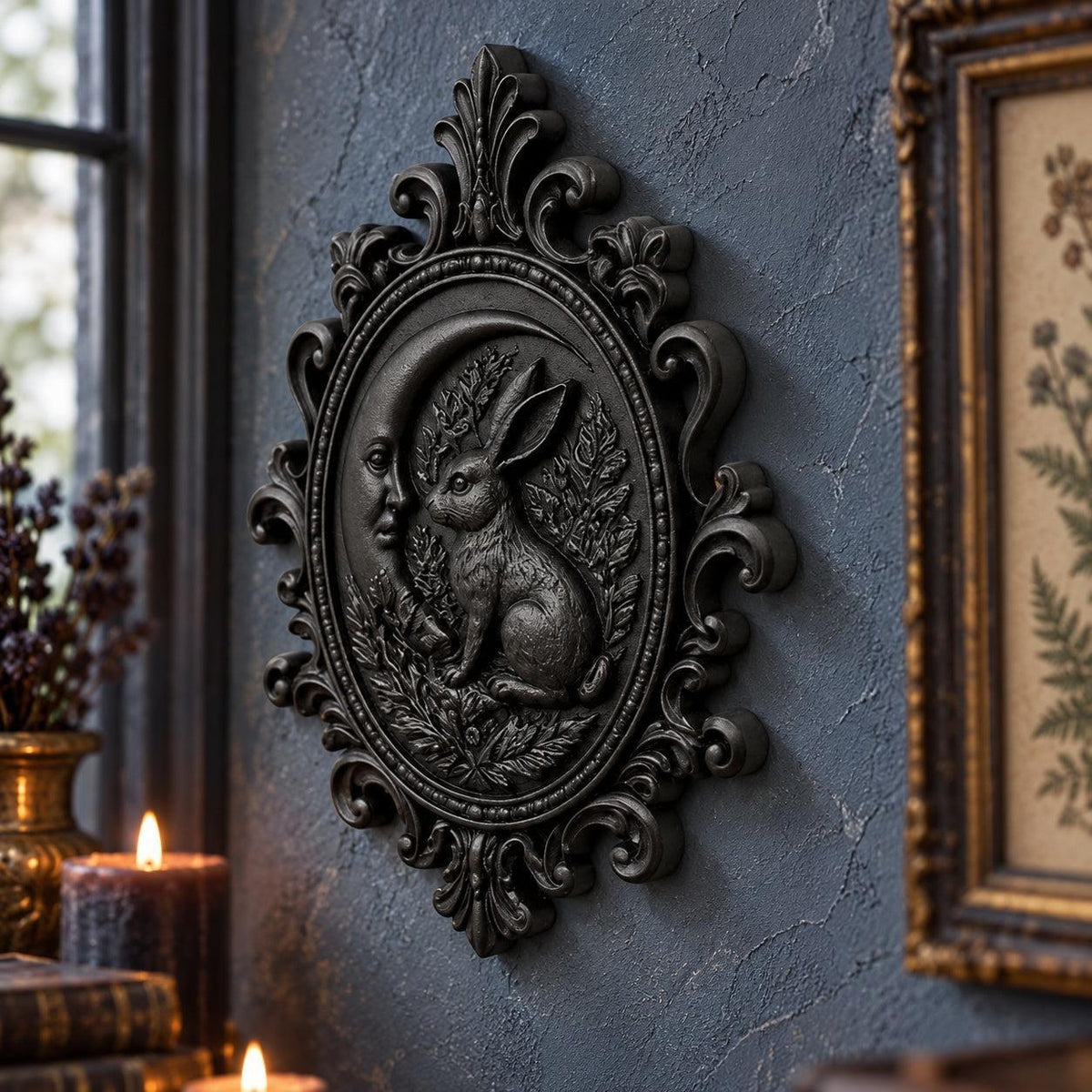 Side angle of sculpted hare: Gothic Crescent Moon Hare Wall Plaque, featuring a woodland hare, crescent moon, botanical relief and an ornate oval frame.