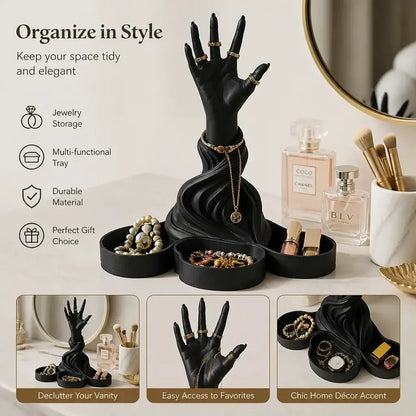 Styled hand organizer with small jewelry: Gothic Hand Sculpture Jewelry Organizer Tray, featuring an upright sculpted hand above multiple small tray compartments.