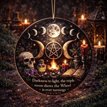 Gothic black ceramic ornament with triple moon phases, pentacle, skull, Yule bottle, and candles.