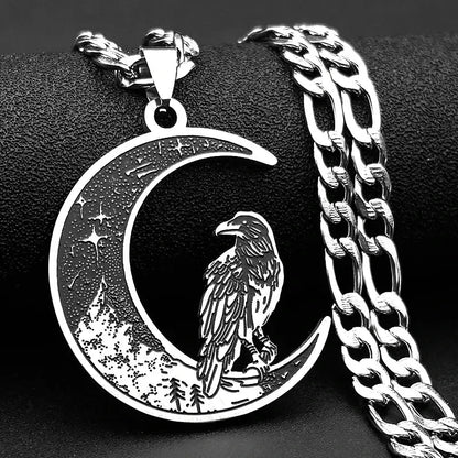 Silver necklace with a crescent moon and raven pendant on a black background