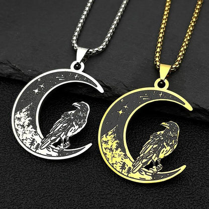 Silver and gold stainless steel crescent moon necklaces with a raven, trees, and stars design.
