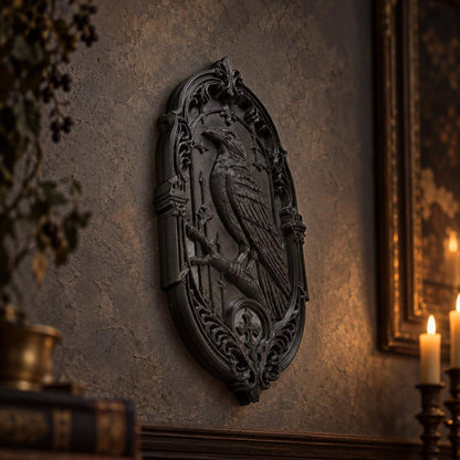 Side view of black raven plaque showing sculpted feathers and ornate border