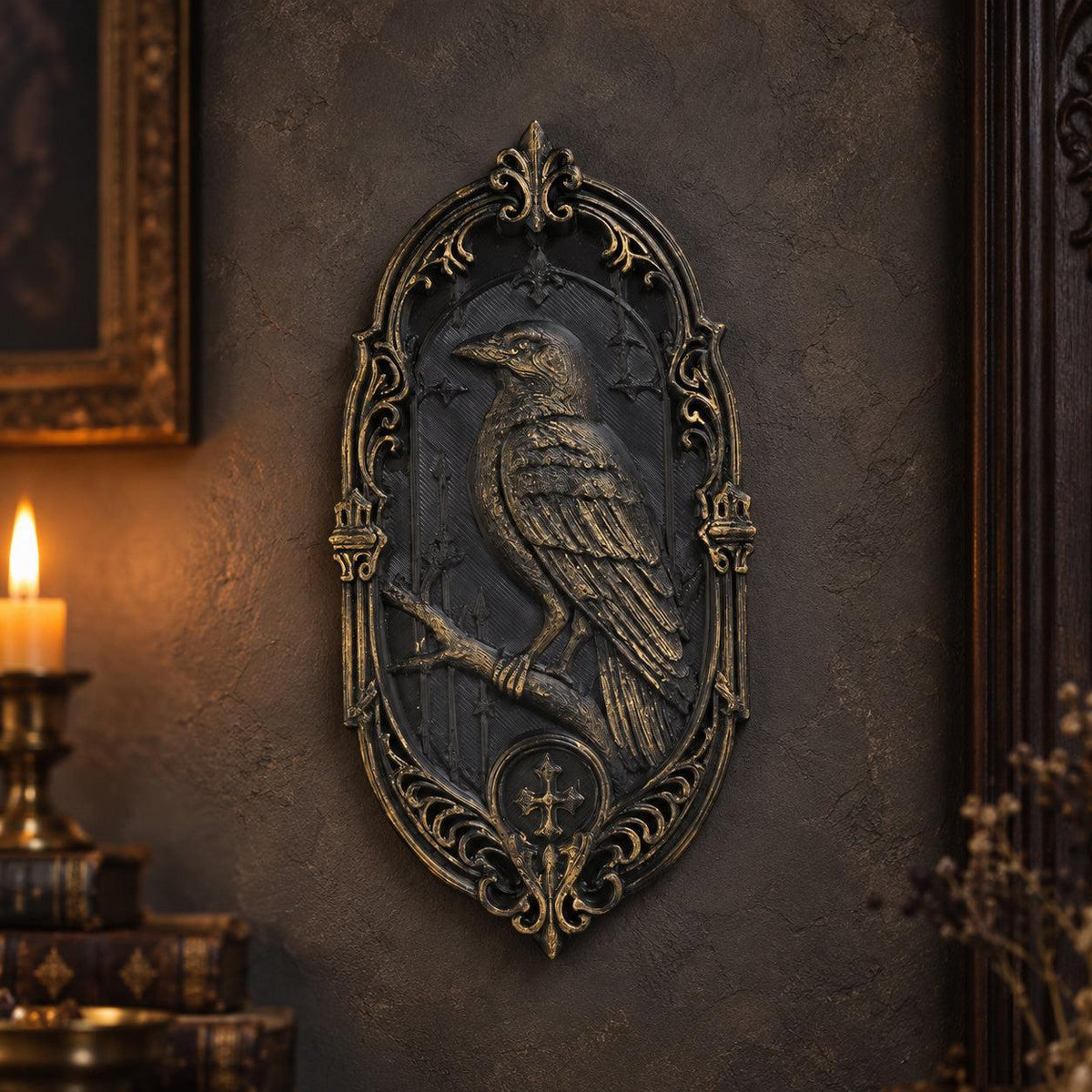 Black and gold raven relief plaque on a gothic wall with detailed feathers and an oval border