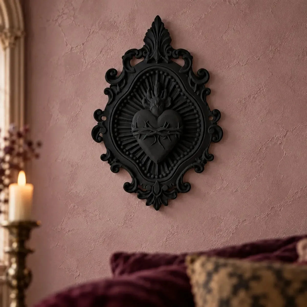 Sacred Heart plaque displayed above a bed in a gothic room
