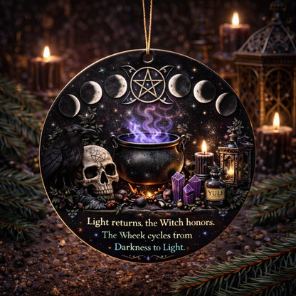 Black ceramic Yule ornament with a skull, raven, cauldron, moon phases, and "Light returns" text.