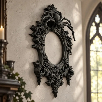Spider wall frame angled view showing raised floral scrollwork