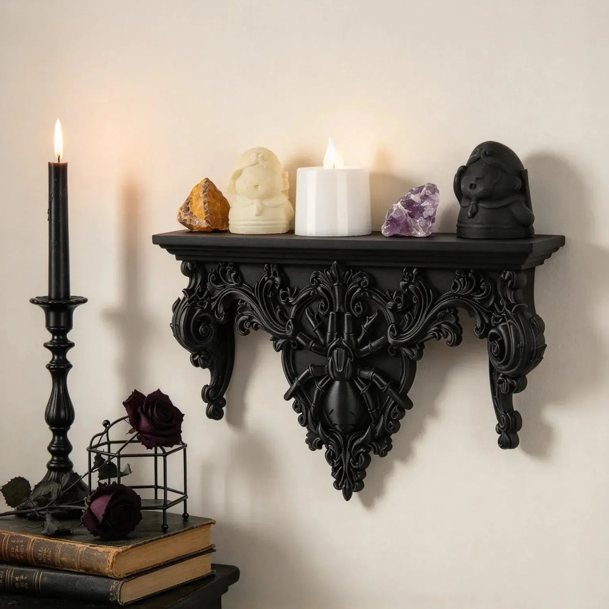 Spider wall shelf displaying crystals, figurines and a flameless candle