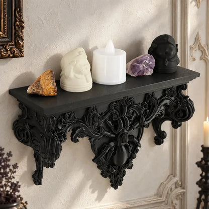 Spider wall shelf displaying small crystals and figurines in a bright gothic room