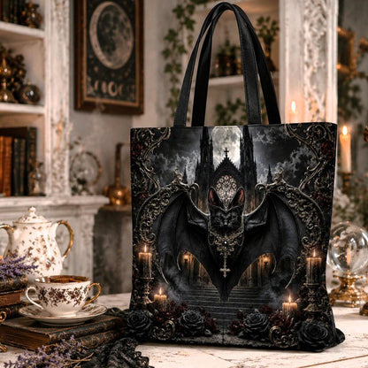 Gothic tote bag design featuring a winged bat with a cross pendant, perched above gothic castle stairs, surrounded by candles and roses.