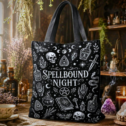 Spellbound Night black tote bag with moth, moon phases, skull, pentacle, and hand illustrations