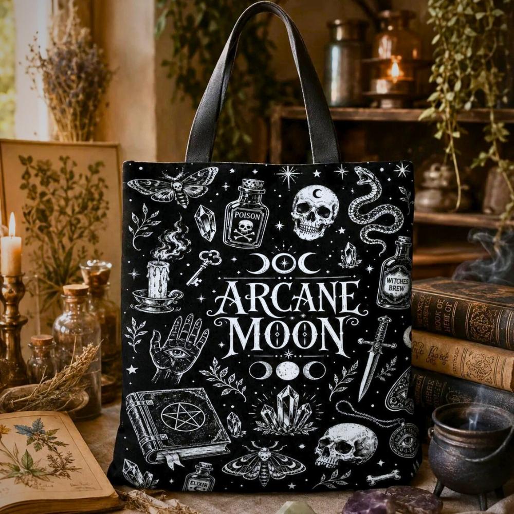 Arcane Moon black tote bag with moth, skull, snake, moon phases, and pentacle book illustrations
