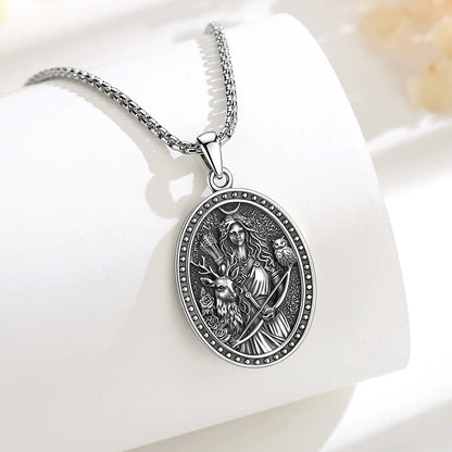 Close-up of the stag and owl detail on the Artemis pendant