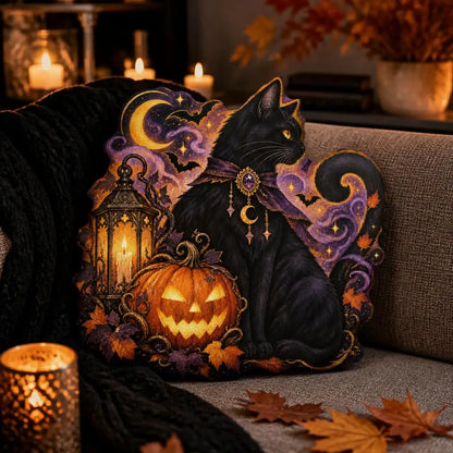 Styled room view: decorative plush pillow featuring cat, pumpkin and crescent moon artwork