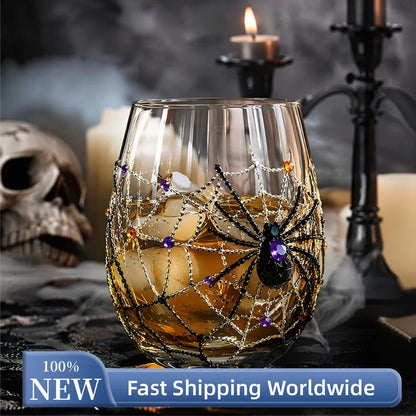 Halloween spider web 3D glass filled with whiskey beside skull and candles