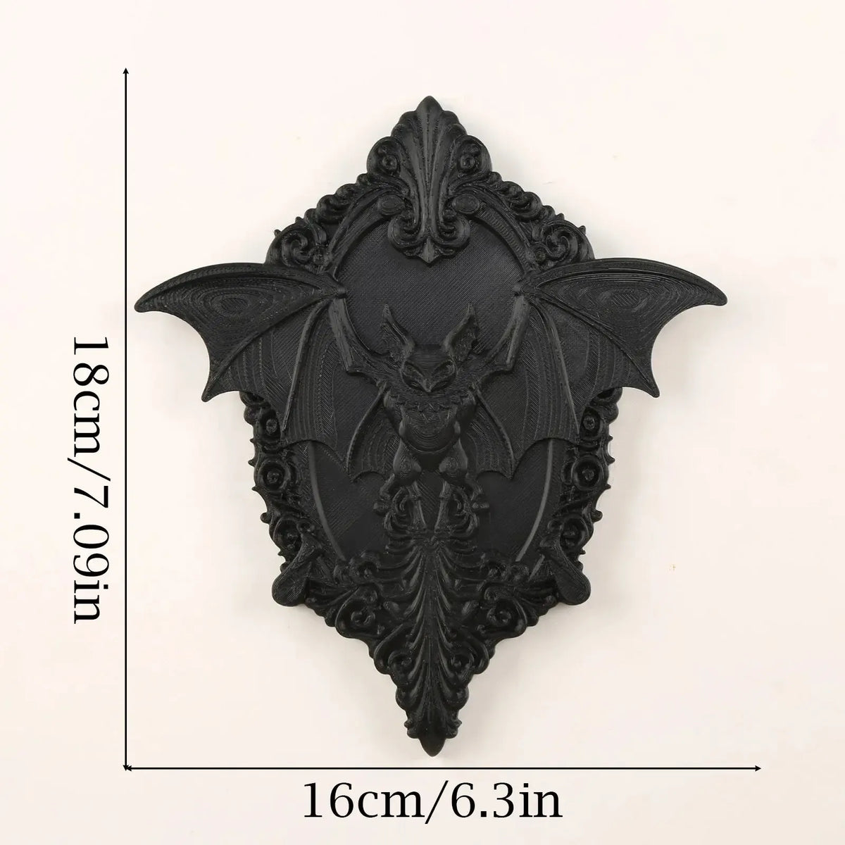 Bat wall plaque styled as Halloween wall decor with candles