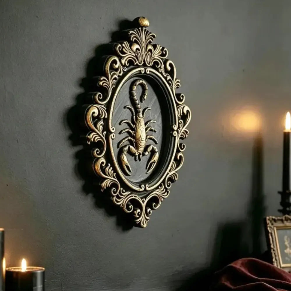 Scorpion wall plaque hung on a dark academia gallery wall