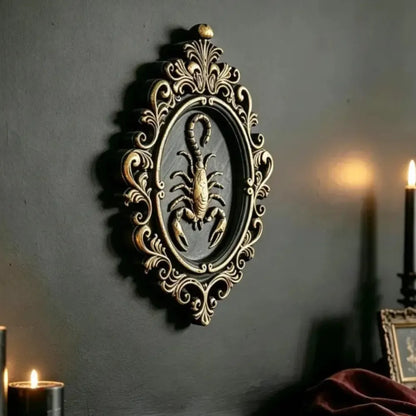 Scorpion wall plaque hung on a dark academia gallery wall