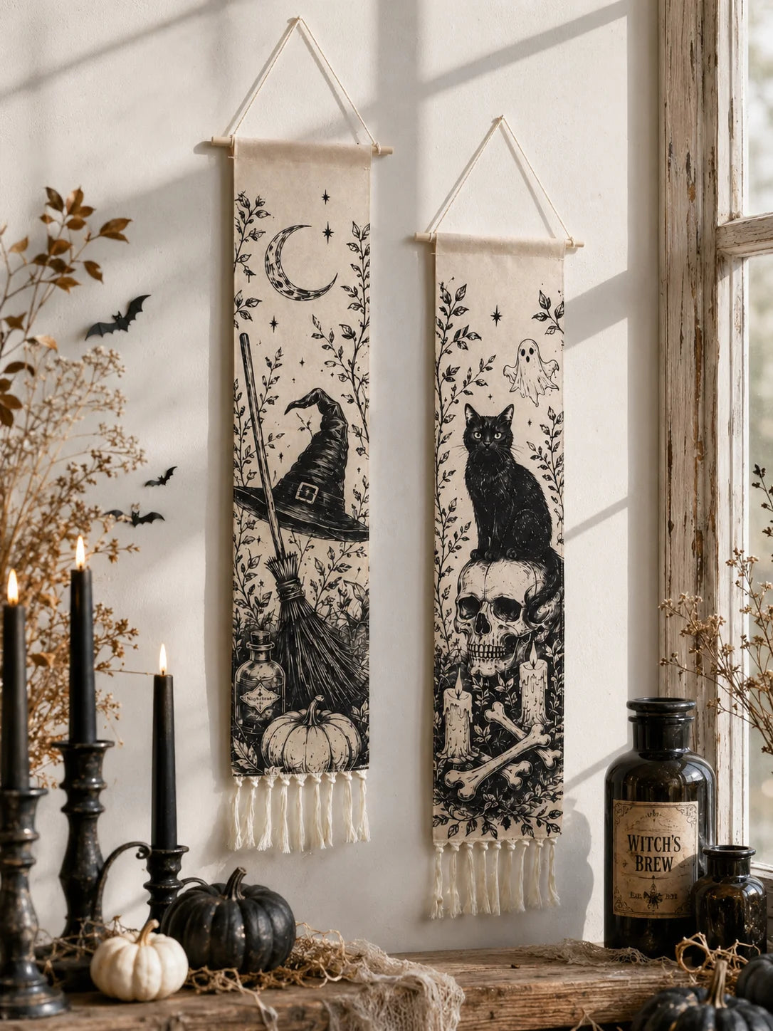 Halloween witch hat and black cat skull tapestries with candles and witch brew bottles