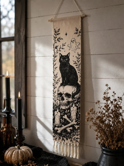 Halloween black cat and skull tapestry hanging by window with candles