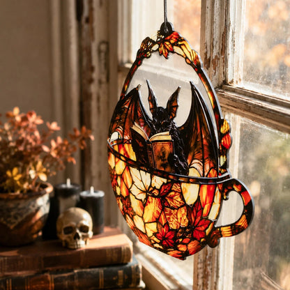 Halloween bat teacup suncatcher by old window with skull and candles